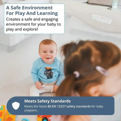 Baby in a blue shirt with a bear design sitting on a playpen, surrounded by toys and text about safety standards. All Stars JOY Baby Playpen by Venture