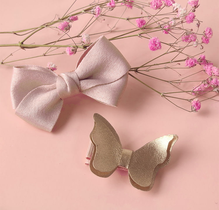 Pink bow and gold butterfly hair clip on a pink background with flowers. Baby Girl Lace Dress Gift Box Christening Birthday Outfit bleu ribbon