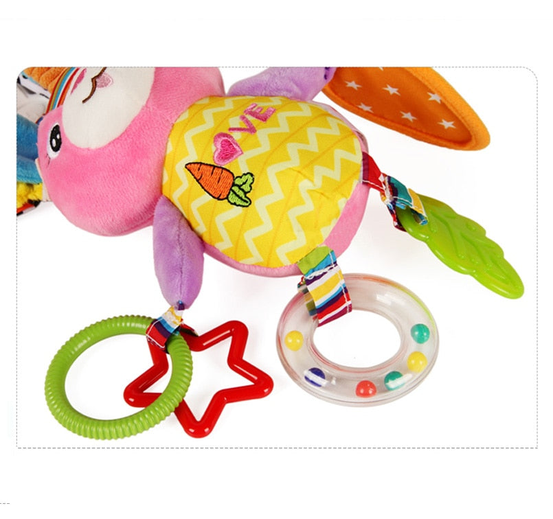 Colorful baby toy with rattle and teether on a white background Baby Stroller & Crib Toy Hanging Plush Sensory Animals bleu ribbon