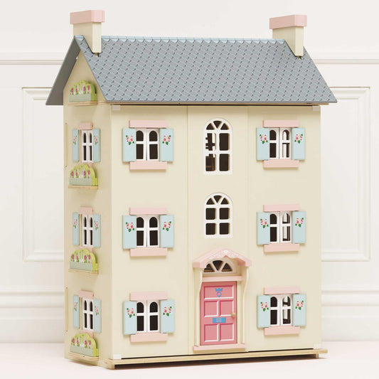 Cherry Tree Hall Wooden Dolls House by Le Toy Van with pastel colors on a white background