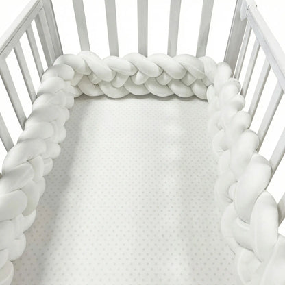 White braided crib bumper around a crib. CozyGuard Braided Crib Bumpers Safe Nursery Protectors BleuRibbon Baby