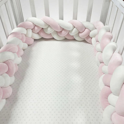 Braided pink and white bumper in a crib. CozyGuard Braided Crib Bumpers Safe Nursery Protectors BleuRibbon Baby