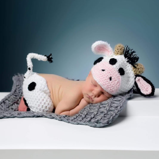 Adorably crafted hand-knitted baby cow suits