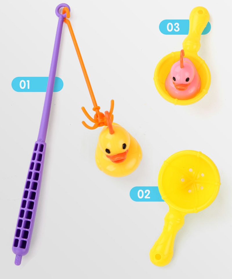 Set of colorful children's toys including a purple tool, yellow duck, and other items on a white background. bleu ribbon