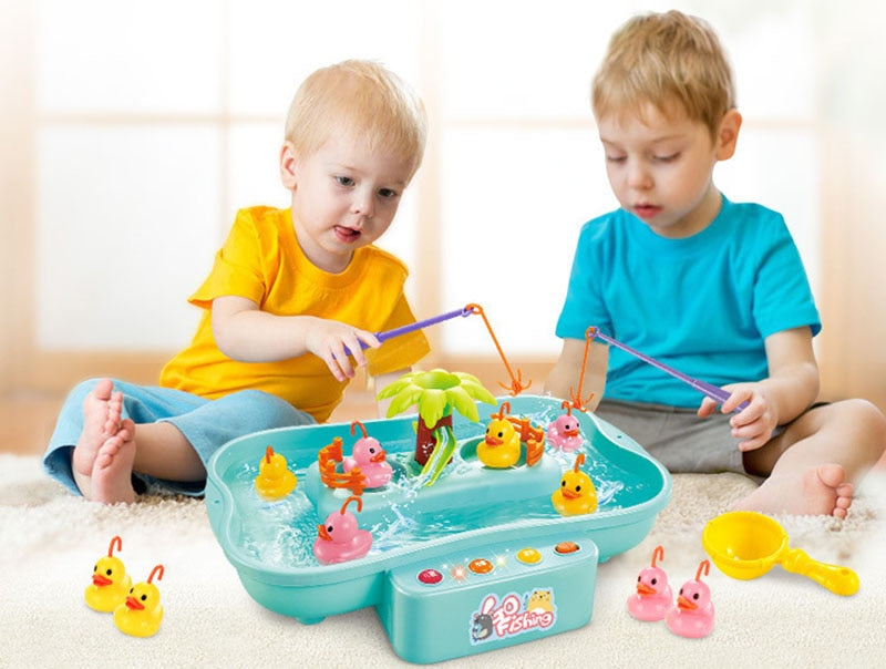 Two children playing with a fishing game set on a light-colored floor. Electric Fishing Game with Water Magnetic Fish Tank Toy bleu ribbon