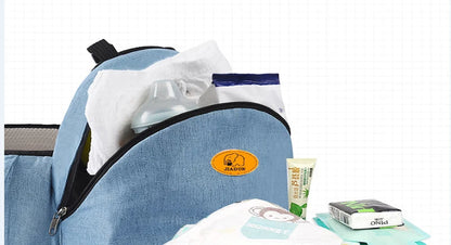 Blue cooler bag with ice packs and snacks on a white background bleu ribbon