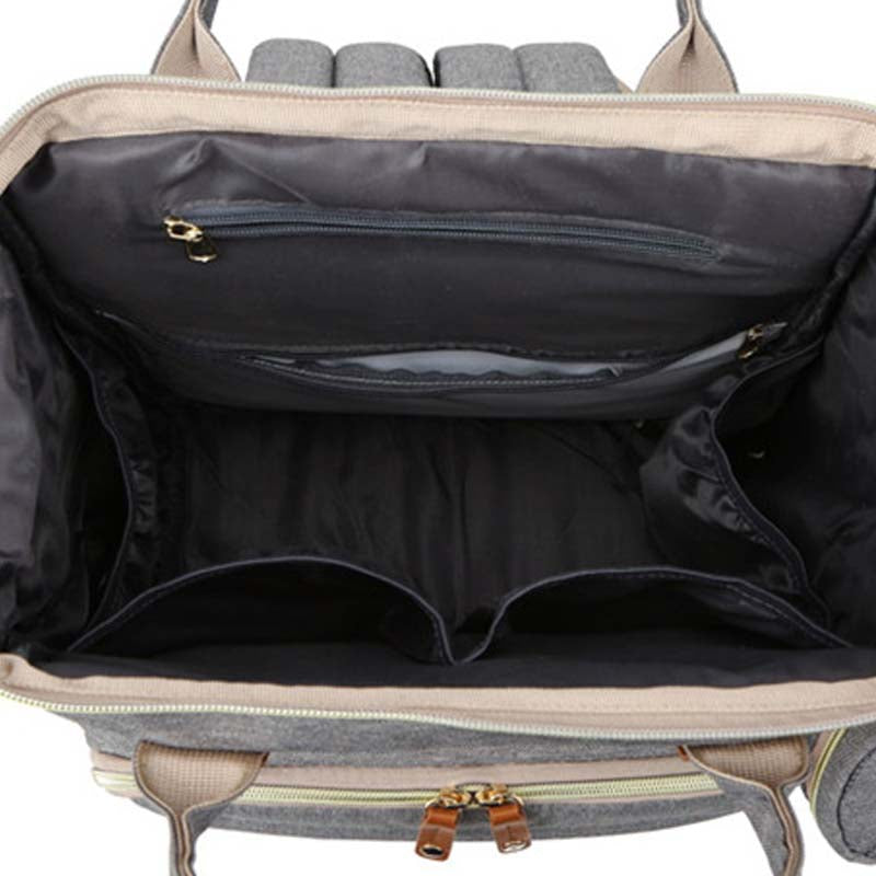 Open suitcase with interior compartments on a white background bleu ribbon