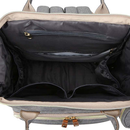 Open suitcase with interior compartments on a white background bleu ribbon