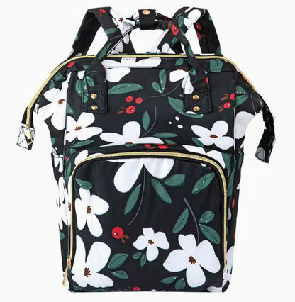 Floral-patterned backpack on a white background. Mosquito Shield Mommy Folding Bed Bag
