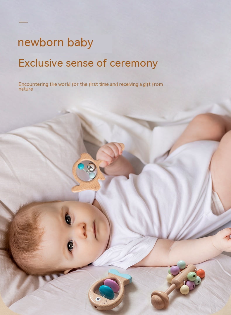 Newborn baby lying on a bed with wooden toys, surrounded by text about the exclusive sense of ceremony. bleu ribbon baby