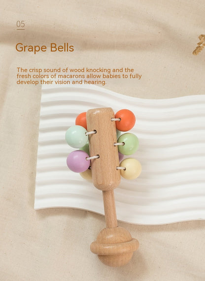 Wooden baby rattle with colorful beads on a beige background bleu ribbon baby