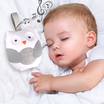 Baby sleeping next to an owl-shaped white noise machine with music notes in the background bleu ribbon