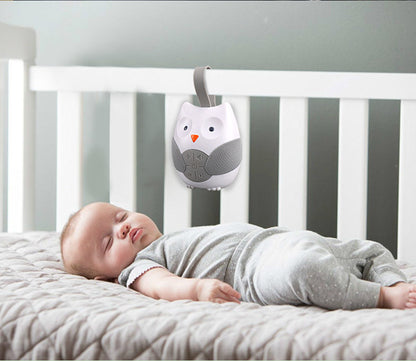 Baby sleeping in a crib with an owl-shaped mobile above Owl Baby Crib Music Box Soothing Sleep Aid 