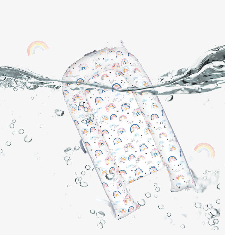 Reusable shopping bag with rainbow pattern partially submerged in water on a white background bleu ribbon baby