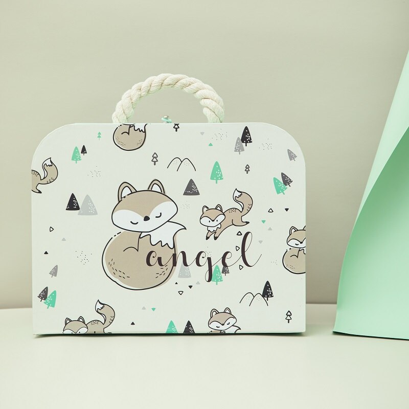 Children's suitcase with fox illustrations and 'angel' text on a light background bleu ribbon baby