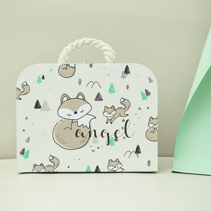 Children's suitcase with fox illustrations and 'angel' text on a light background bleu ribbon baby