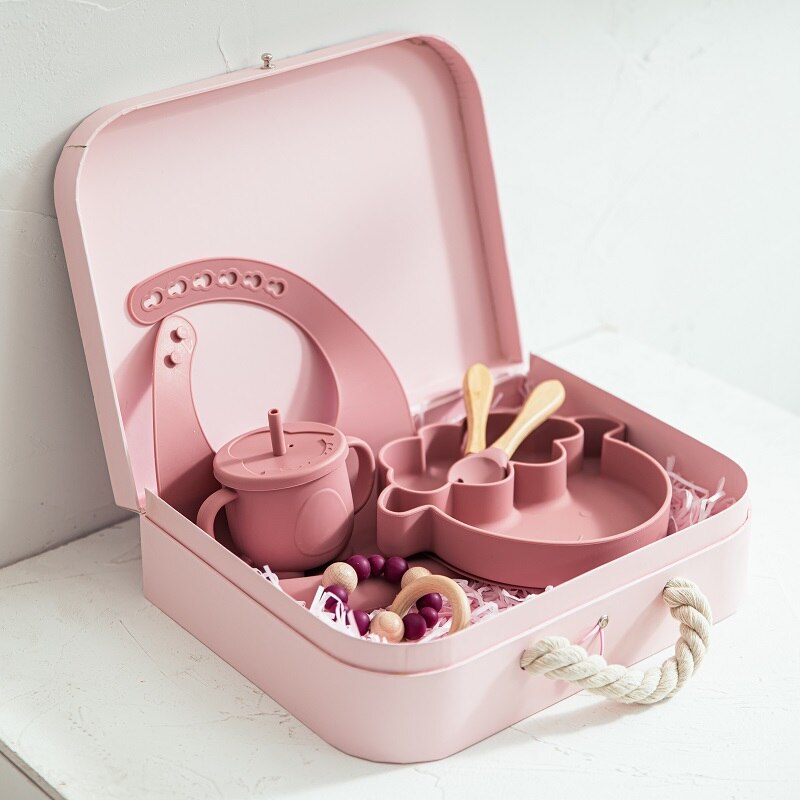 Pink children's tea set in a suitcase on a white surface bleu ribbon baby