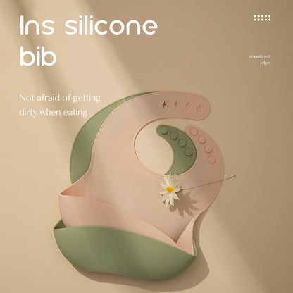 Silicone bib with floral design on a beige background bleu ribbon baby