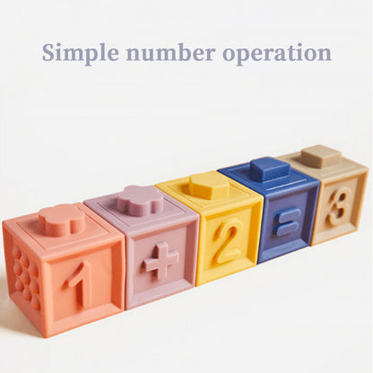 Colorful toy blocks with numbers and mathematical symbols on a light background Soft Baby Building Blocks Squeezable Teething Toys & Bath Blocks bleu ribbon