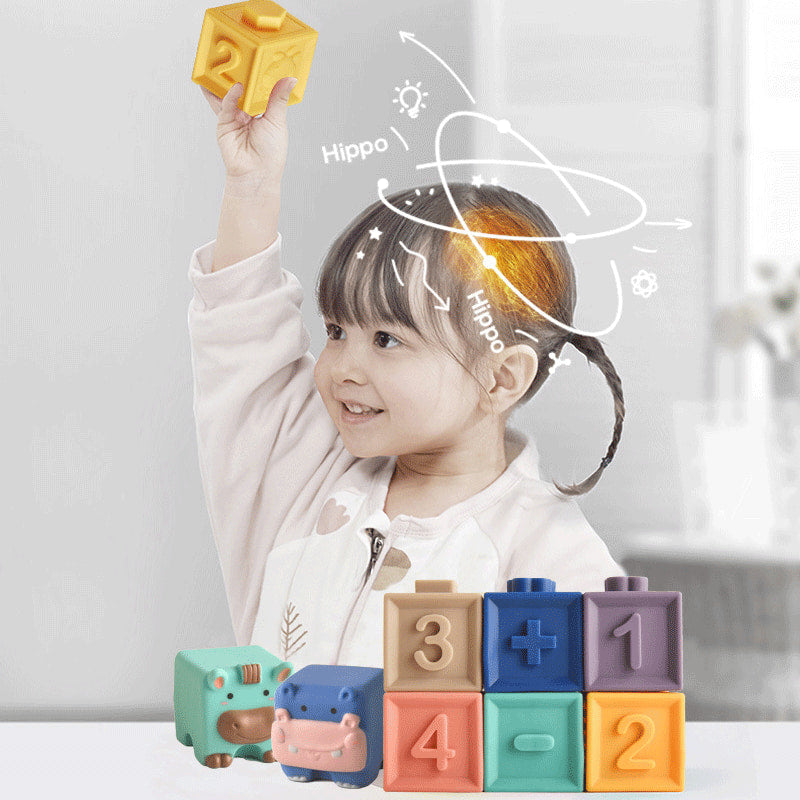 Child playing with colorful toy blocks, with 'Hippo' branding visible. bleu ribbon baby