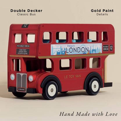 Red double-decker toy bus with gold paint details on a beige background. London Wooden Bus by Le Toy Van