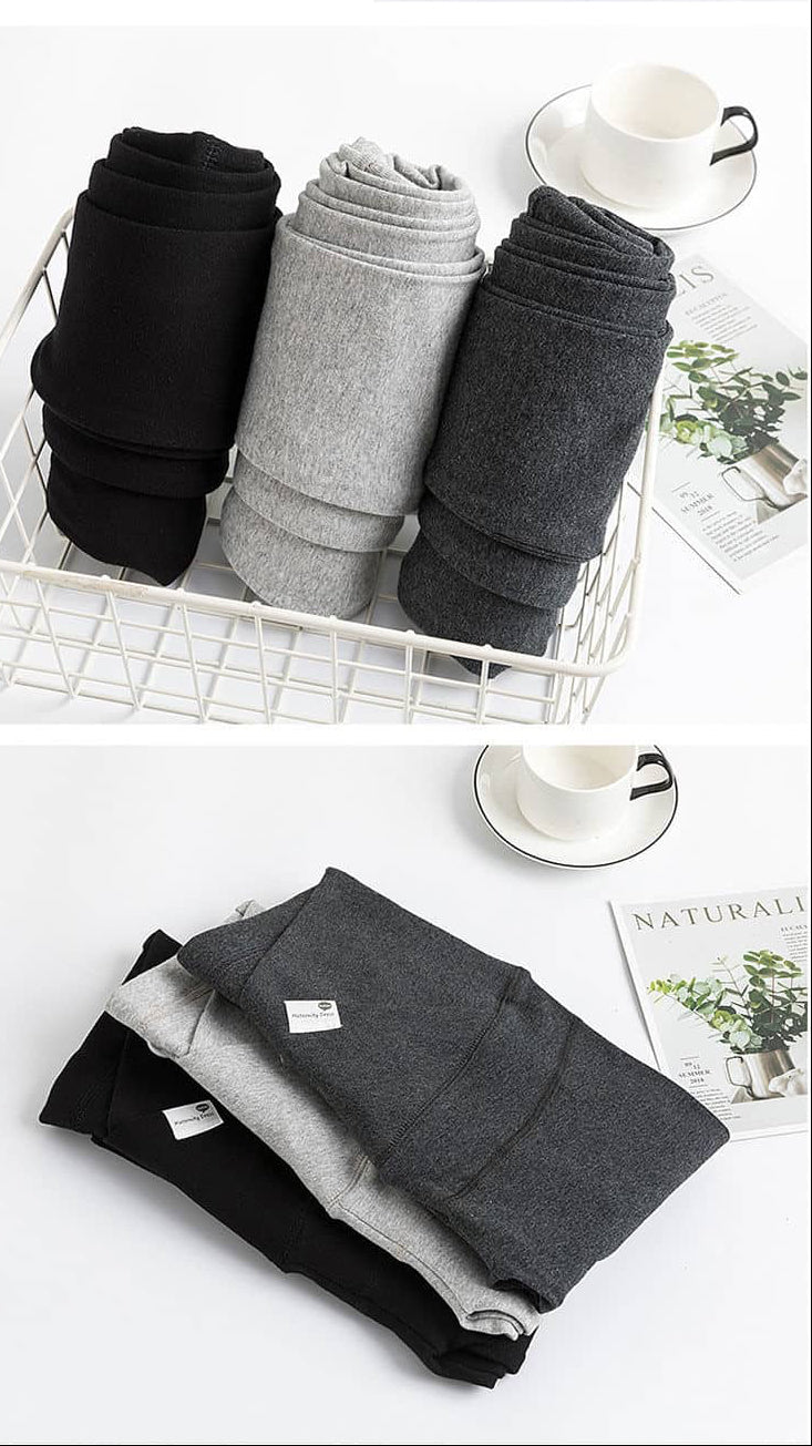 Folded black, gray, and white pants in a basket on a white surface. V-Waist Maternity Support Leggings Cotton Pregnancy Yoga Pants bleu ribbon