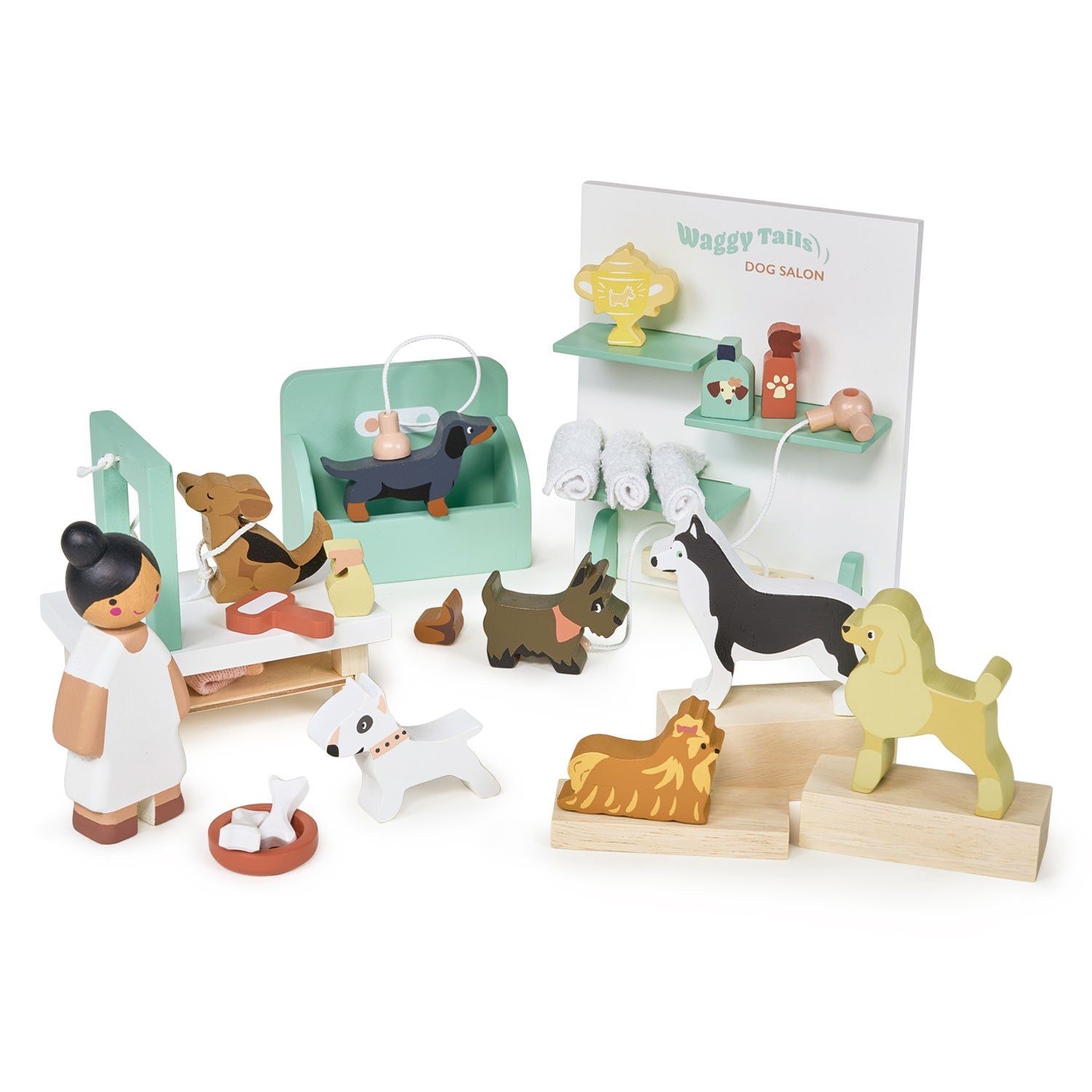 Wooden toy set with dogs and a vet, including a 'Dog Salon' sign, on a white background. Waggy Tails Dog Salon by Tender Leaf Toys - Wooden dog grooming set with 7 breeds