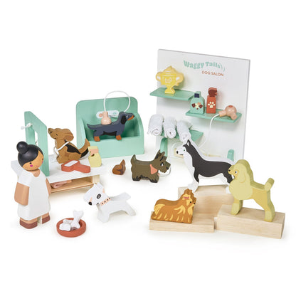 Wooden toy set with dogs and a vet, including a 'Dog Salon' sign, on a white background. Waggy Tails Dog Salon by Tender Leaf Toys - Wooden dog grooming set with 7 breeds