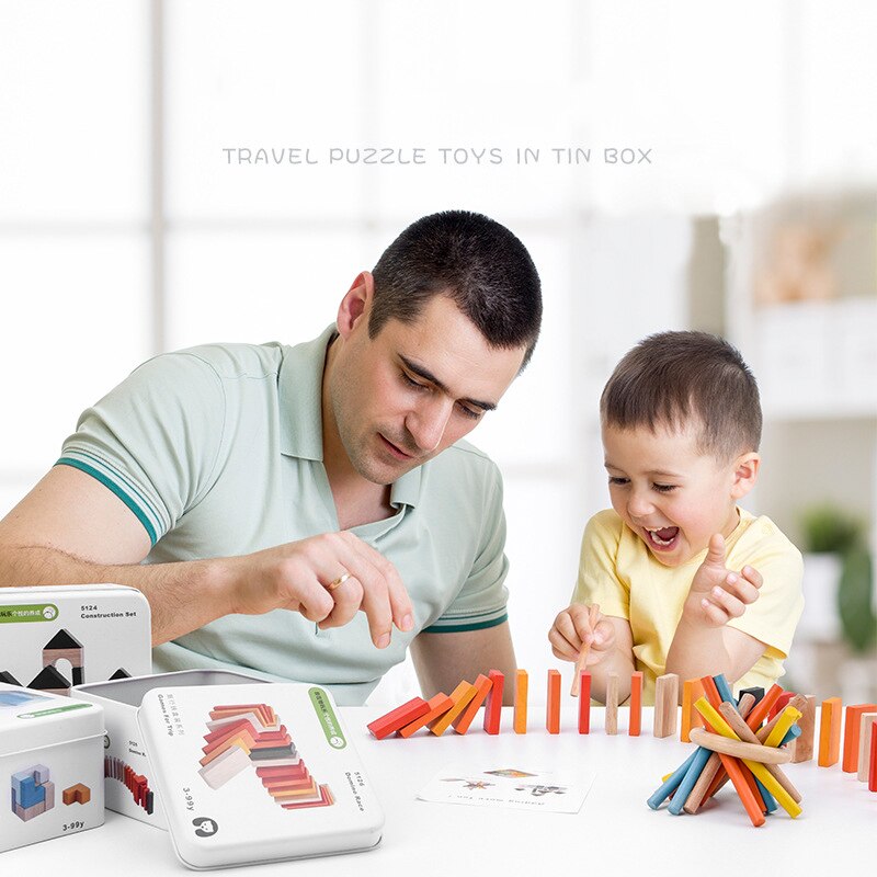 Man and child playing with colorful building blocks on a table. Wooden Cube Puzzle in Tin Box Toddler Travel Toy & Brain Teaser bleu ribbon