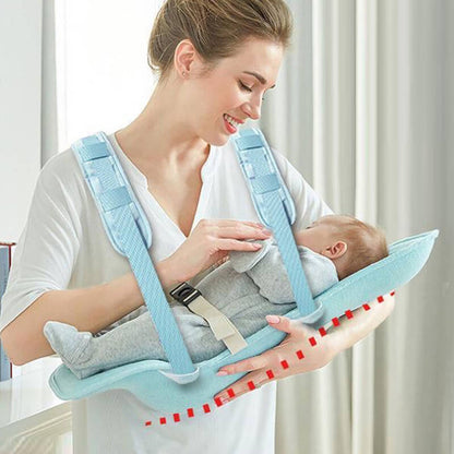 Baby resting comfortably on nursing pillow designed to prevent reflux and spit-up.
