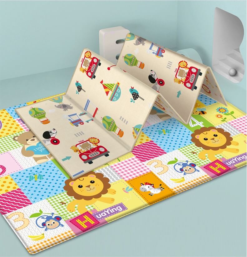 BleuRibbon Baby Crawling Mat with Lion King and Green World patterns, safe and eco-friendly for baby playtime.