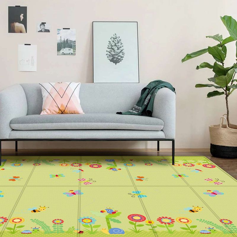 BleuRibbon Baby Crawling Mat with Lion King and Green World patterns, safe and eco-friendly for baby playtime.