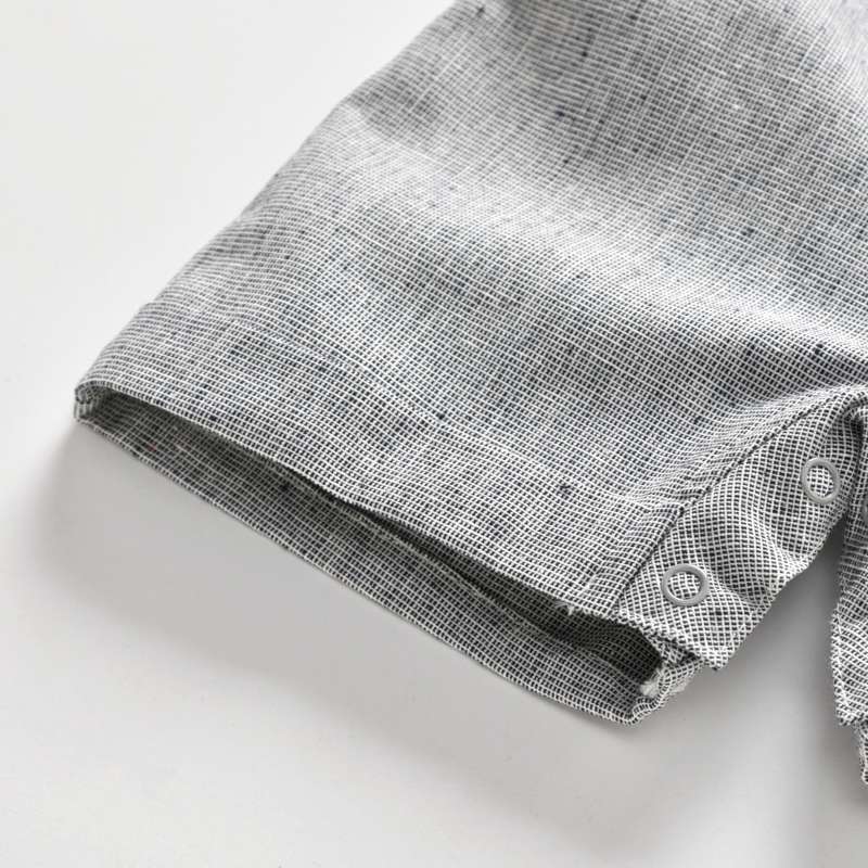 Folded gray fabric on a white background bleu ribbon baby