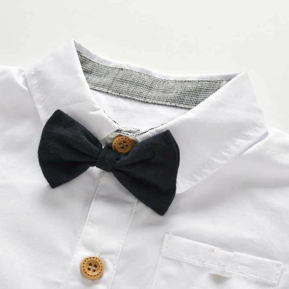 White shirt with a black bow tie and wooden buttons on a white background bleu ribbon baby
