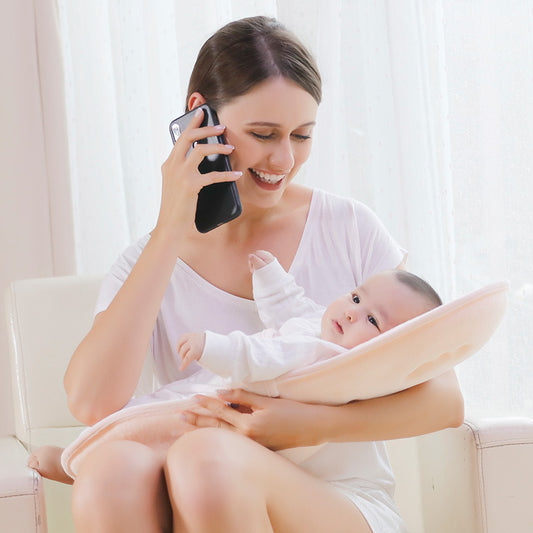 BleuRibbon Baby hands-free nursing pillow for comfortable feeding. Soft, breathable, and supportive for moms and babies.