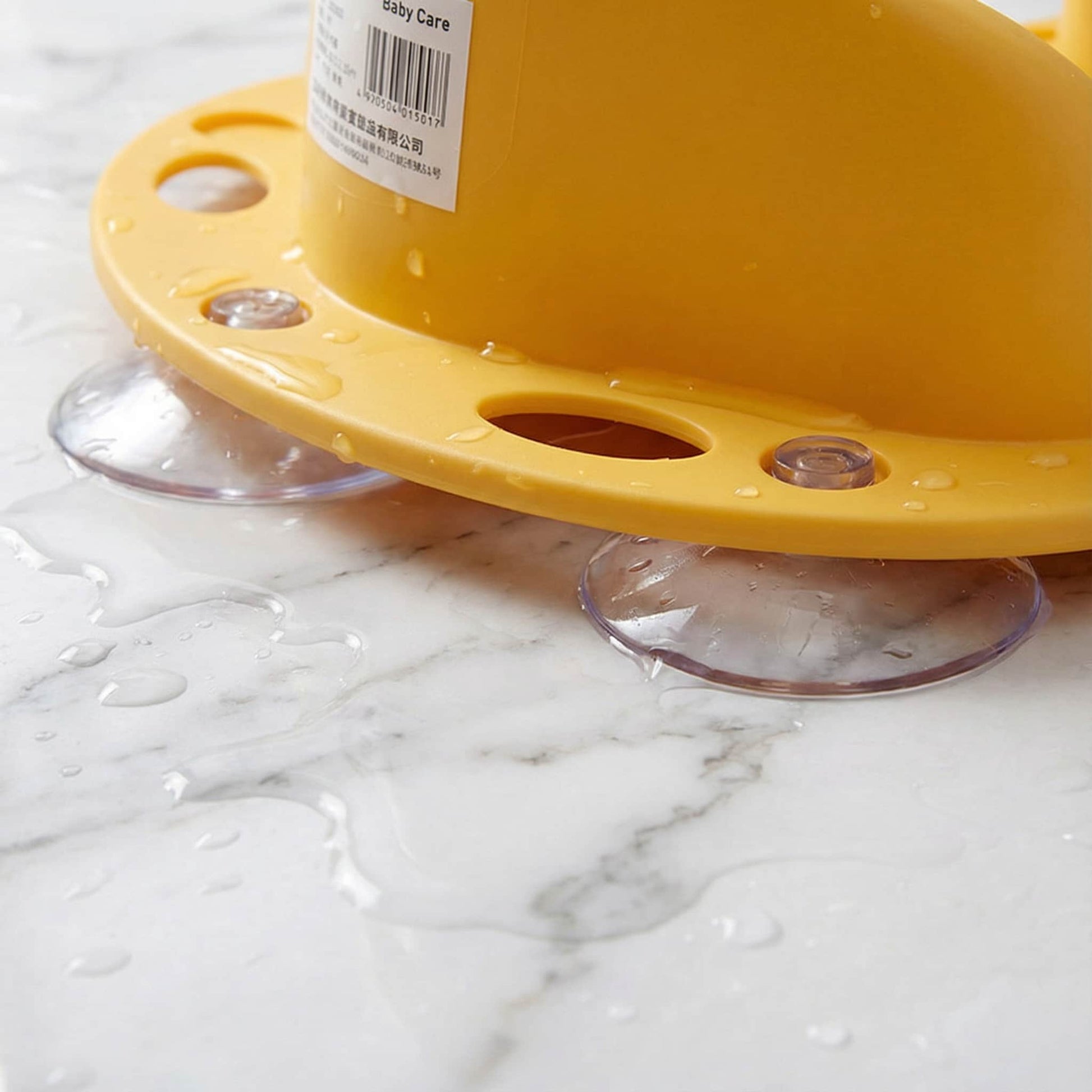 Detail of strong suction cups on BleuRibbon bath seat base. Prevents slipping and sliding for maximum baby safety.