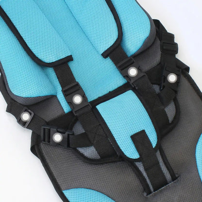 Close-up of a blue and Soft Headrest Padding on Booster Seat – CozyLift with black straps on a white background
