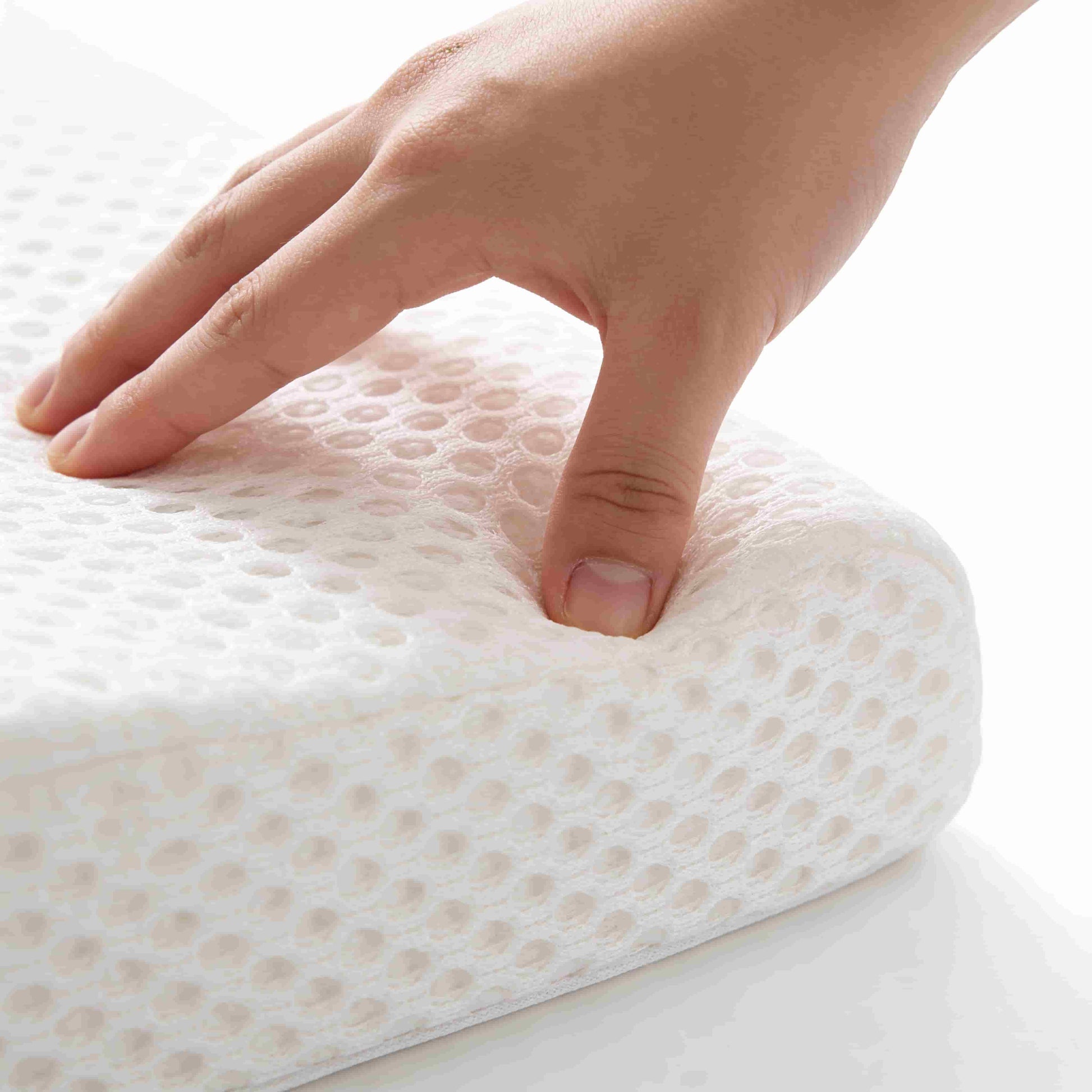 Close-up detail of BleuRibbon baby wedge pillow showing breathable 3D mesh fabric surface and high-density memory foam. Hypoallergenic and safe material for infants.