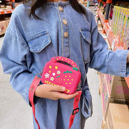 Person holding a pink strawberry-shaped bag in a store setting bleu ribbon baby
