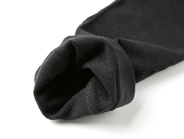 Close-up of a black sock on a white background bleu ribbon