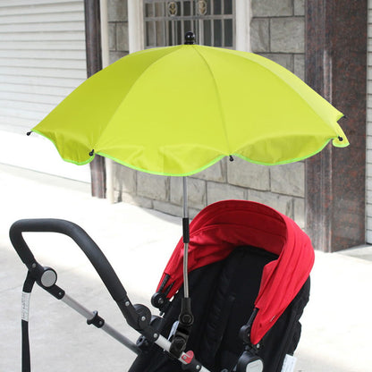 Yellow umbrella attached to a red and black stroller in an urban setting. bleu ribbon baby