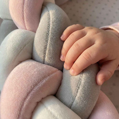 Close-up of soft hypoallergenic velvet fabric on BleuRibbon braided bumper. Gentle touch safe for newborn skin with premium stitching details.