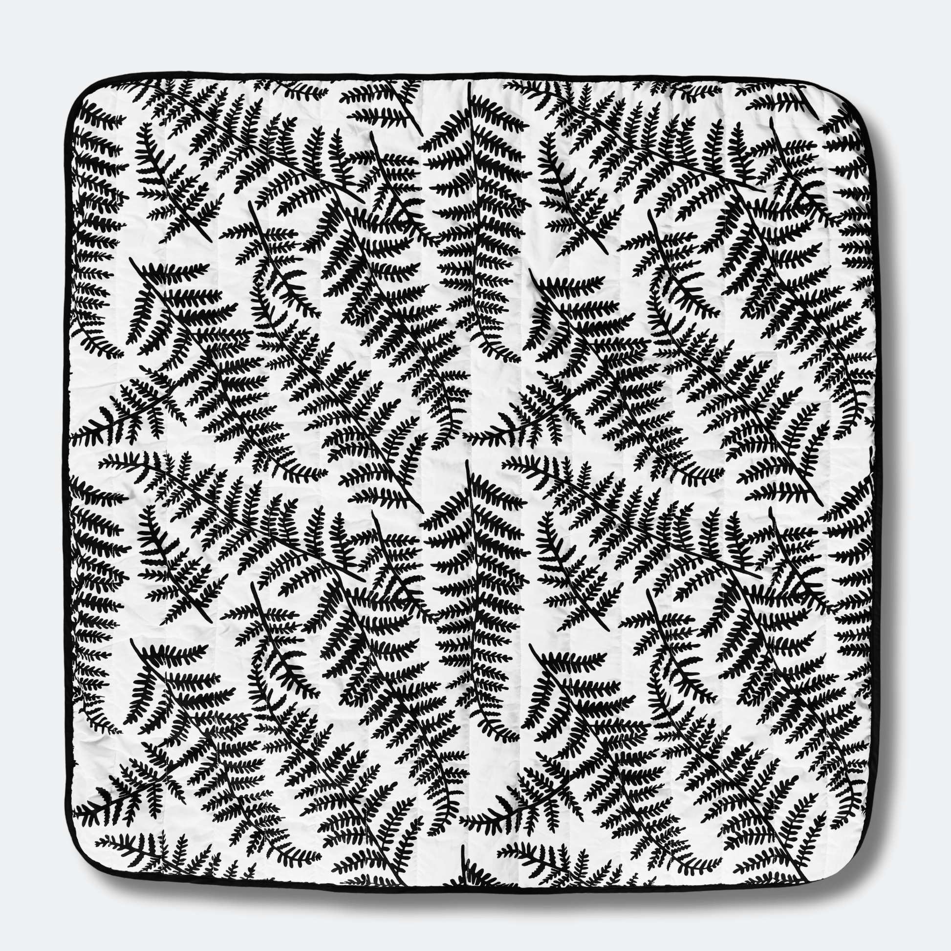 Full top view of the square Etta Loves outdoor playmat displaying the high-contrast black and white sensory fern pattern designed for visual development.