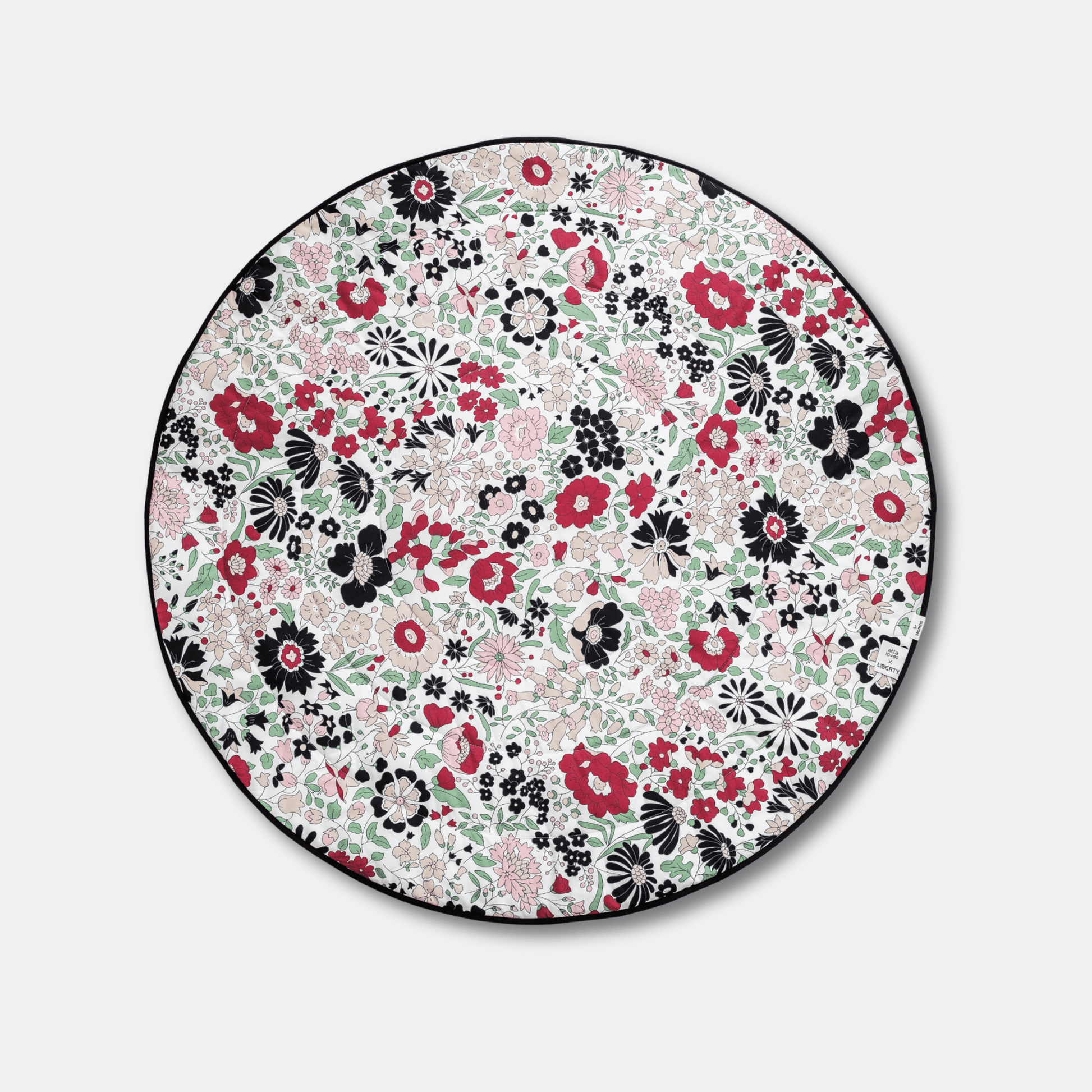Top view of the circular, colorful Wharfedale Meadow side of the Etta Loves x Liberty sensory playmat, designed for babies from 5 to 12 months.