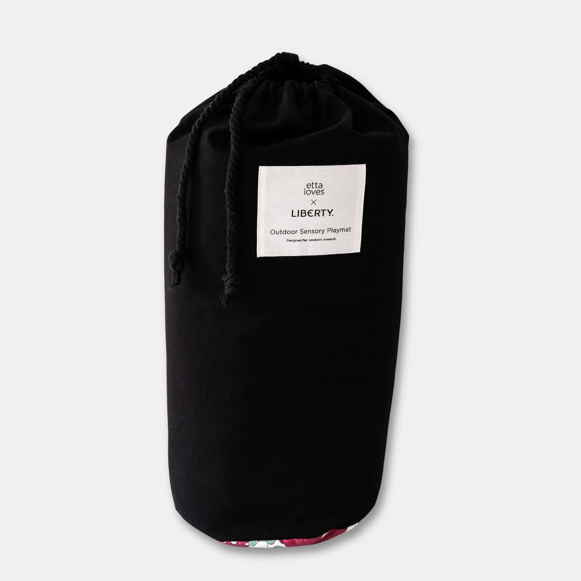 Black canvas carry bag with a convenient shoulder strap, included with the Etta Loves outdoor sensory baby playmat.
