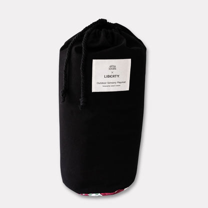 Black canvas carry bag with a convenient shoulder strap, included with the Etta Loves outdoor sensory baby playmat.