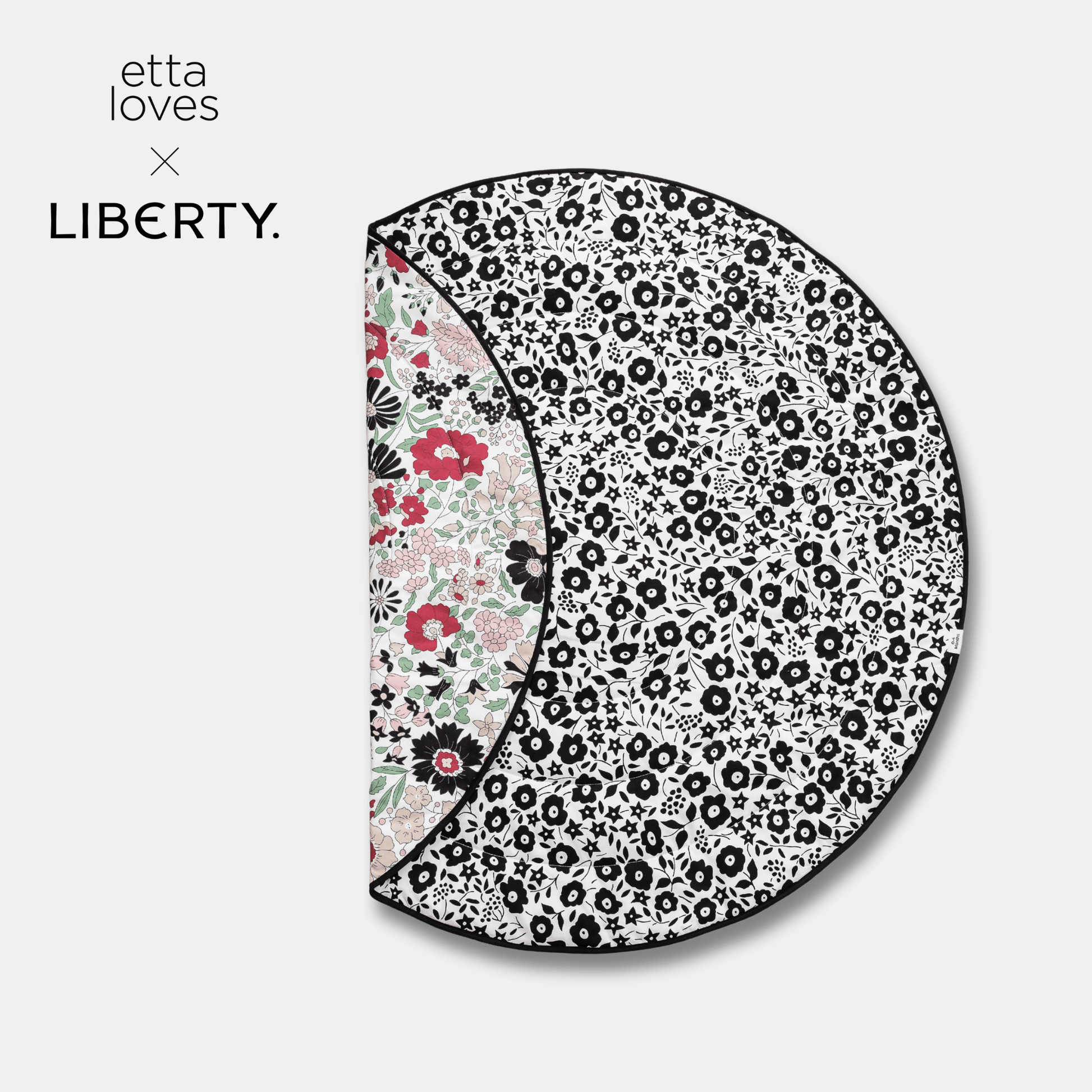 Etta Loves x Liberty collaboration logo next to the folded round reversible sensory playmat displaying both developmental stages.