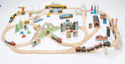 Wooden train set with tracks, cars, and buildings on a white background Mountain View Wooden Train Set 58-piece set by Tender Leaf Toys
