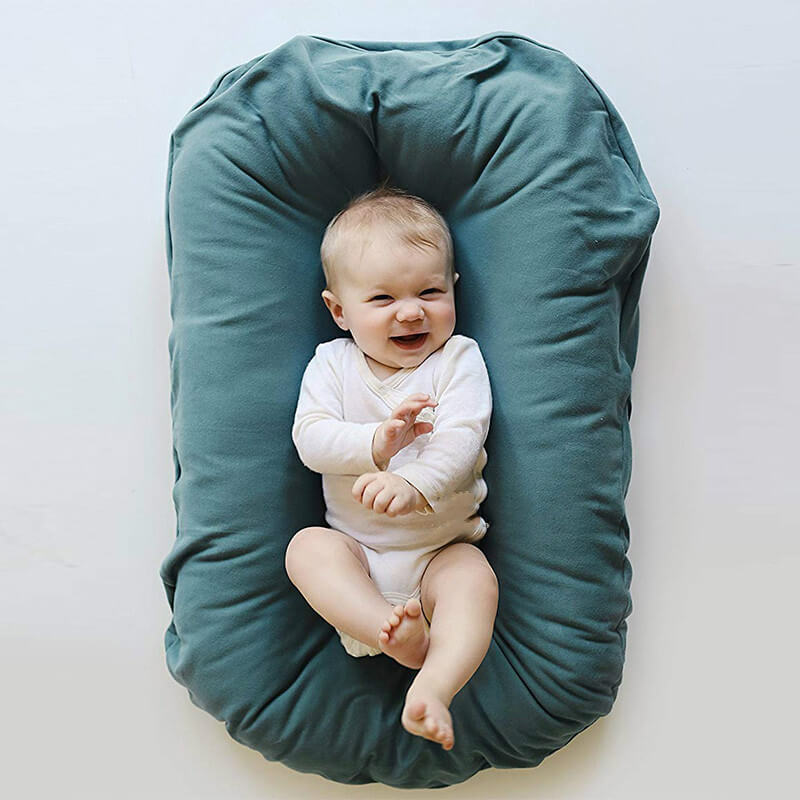 BleuRibbon Baby Portable Nest Bed, pure cotton comfort for newborns and toddlers, cozy and lightweight.