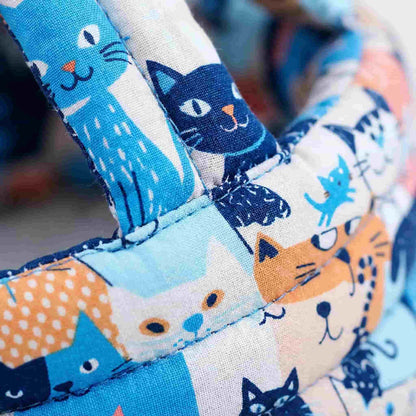 Close-up macro shot of the breathable cotton fabric and high-quality stitching on the SafePlay baby head protector helmet.